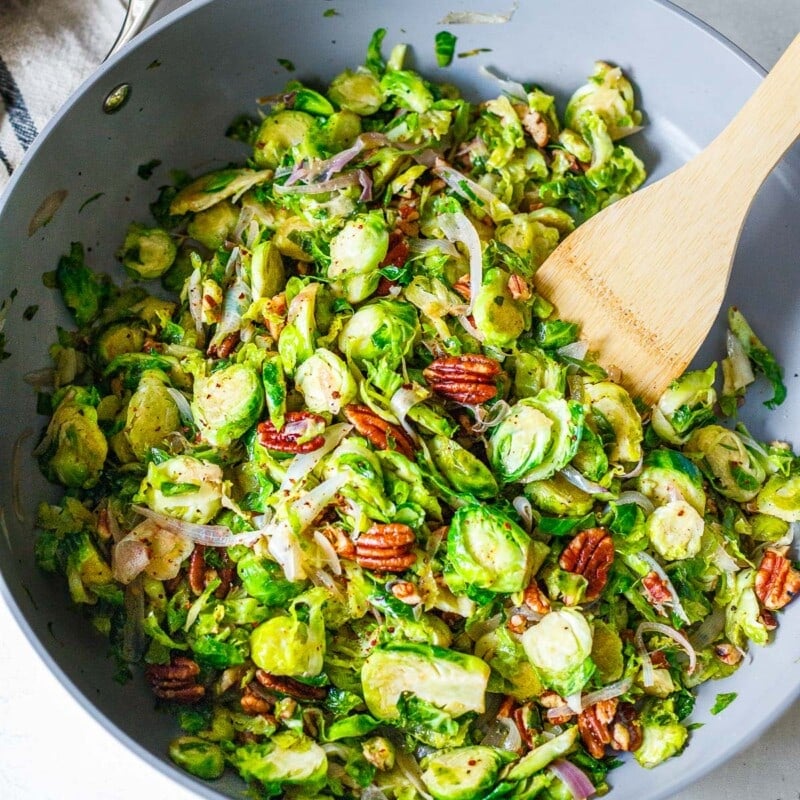 Sauteed Brussels sprouts with pecans, shallots and garlic. A quick, easy side dish that can be made in 20 minutes. Vegan and gluten-free.