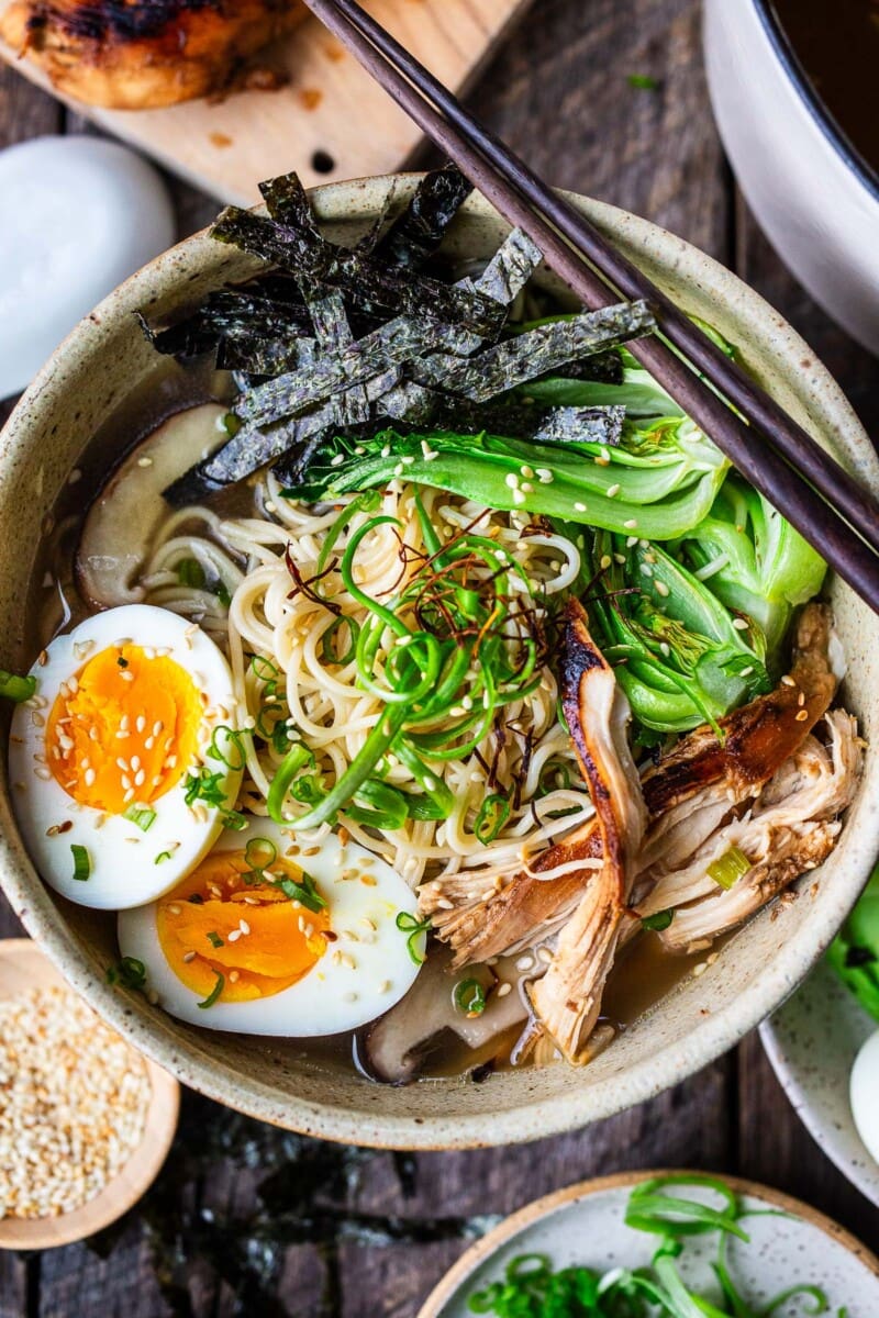 Learn the secret to the best homemade chicken ramen! It features a rich, savory, unctuous chicken bone broth with roasted chicken, bok choy, shiitake mushrooms, and ramen noodles.