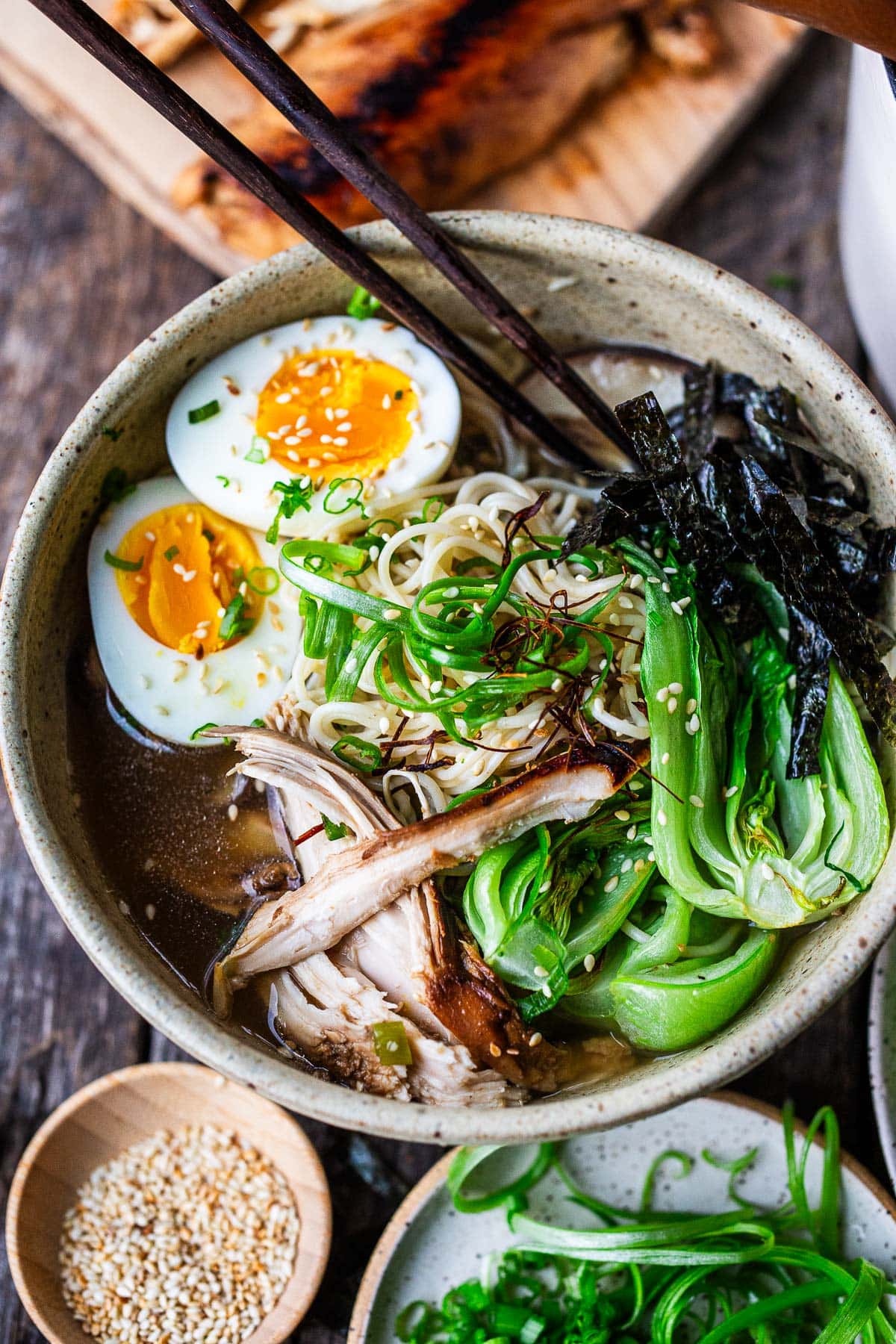 Learn the secret to the best homemade chicken ramen! It features a rich, savory, unctuous chicken bone broth with roasted chicken, bok choy, shiitake mushrooms, and ramen noodles.