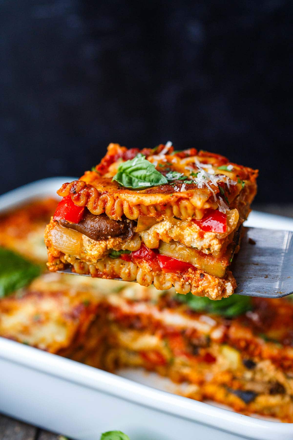The best Veggie Lasagna recipe! This homemade vegetarian lasagna is layered with savory roasted vegetables, marinara sauce, ricotta, and goat cheese- a cozy vegetarian dinner perfect for feeding a crowd.