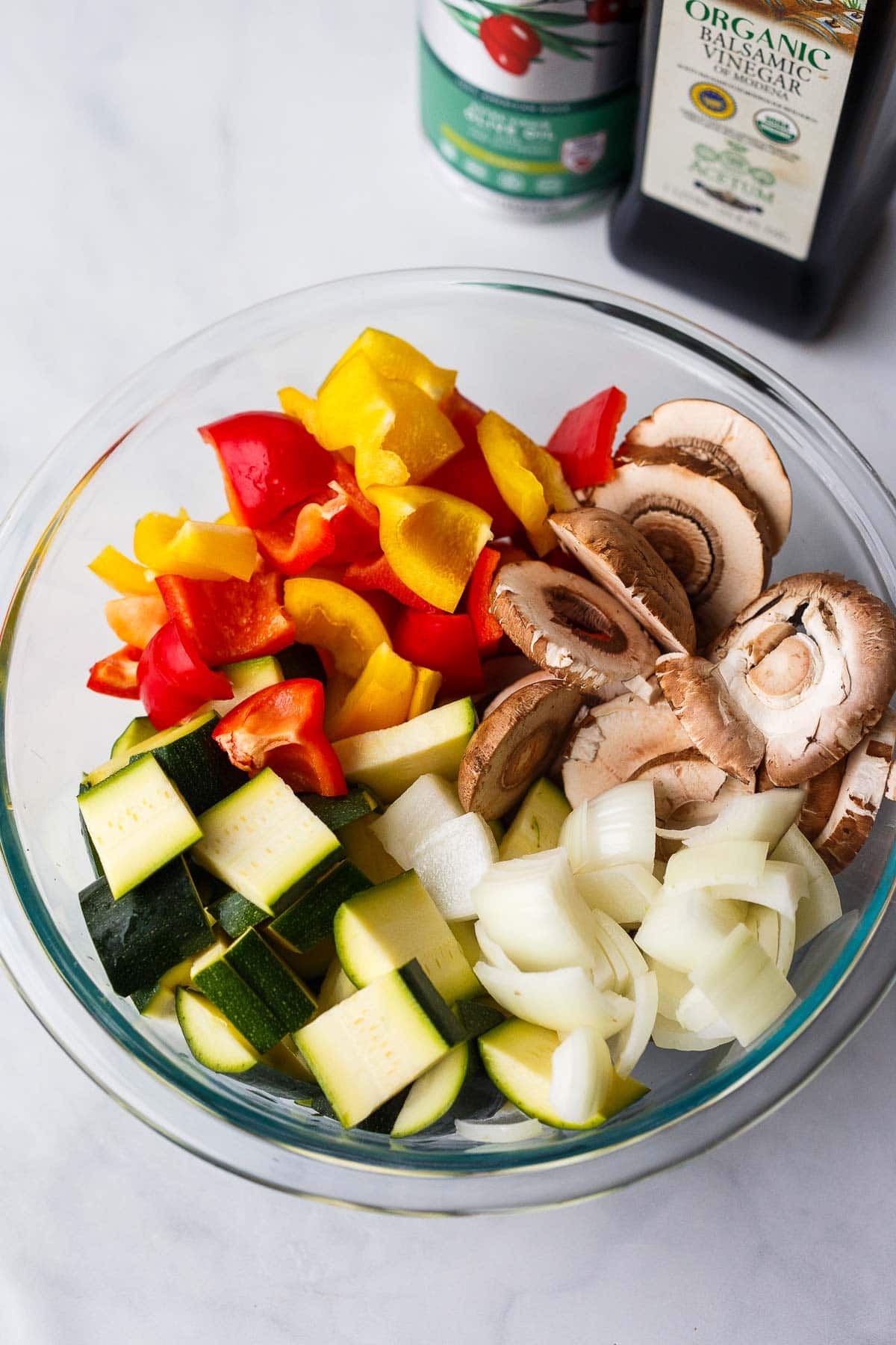 bowl of chopped veggies - mushrooms, bell peppers, onions, and zucchini.