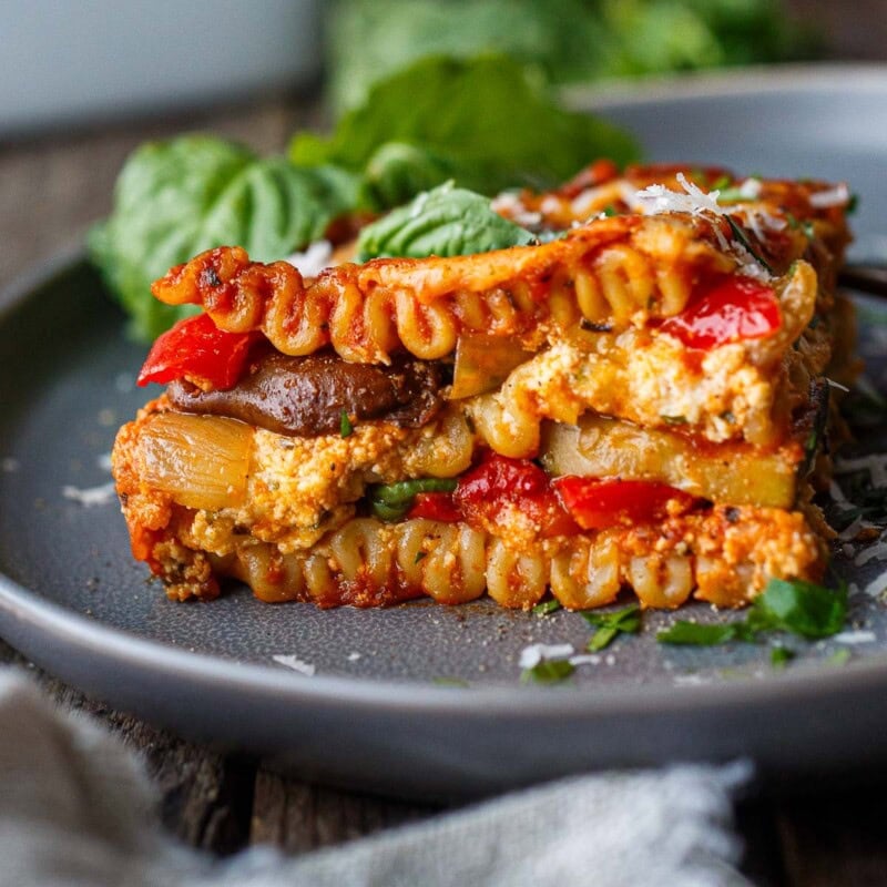 a piece of roasted vegetable lasagna on a plate.