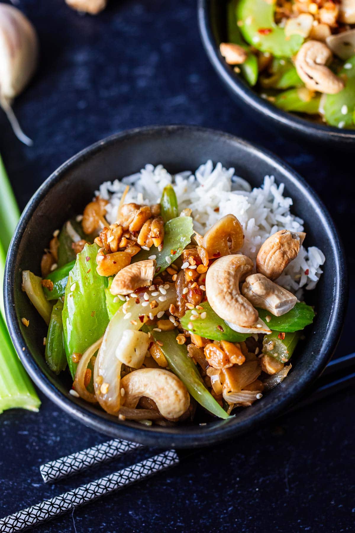 bowl of celery stirfry over jasmine rice with cashews. 