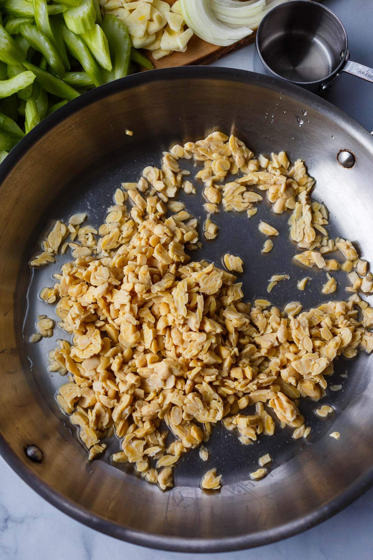 skillet with crumbled tempeh and water. 