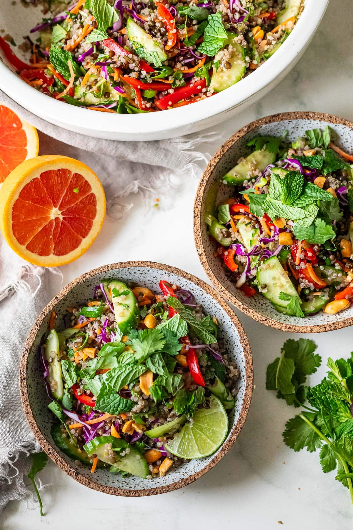 This bright and cheery Lentil Quinoa Salad is packed with Thai flavor! Crunchy veggies and fragrant herbs in a tangy Thai Dressing. Vegan & gluten-free.