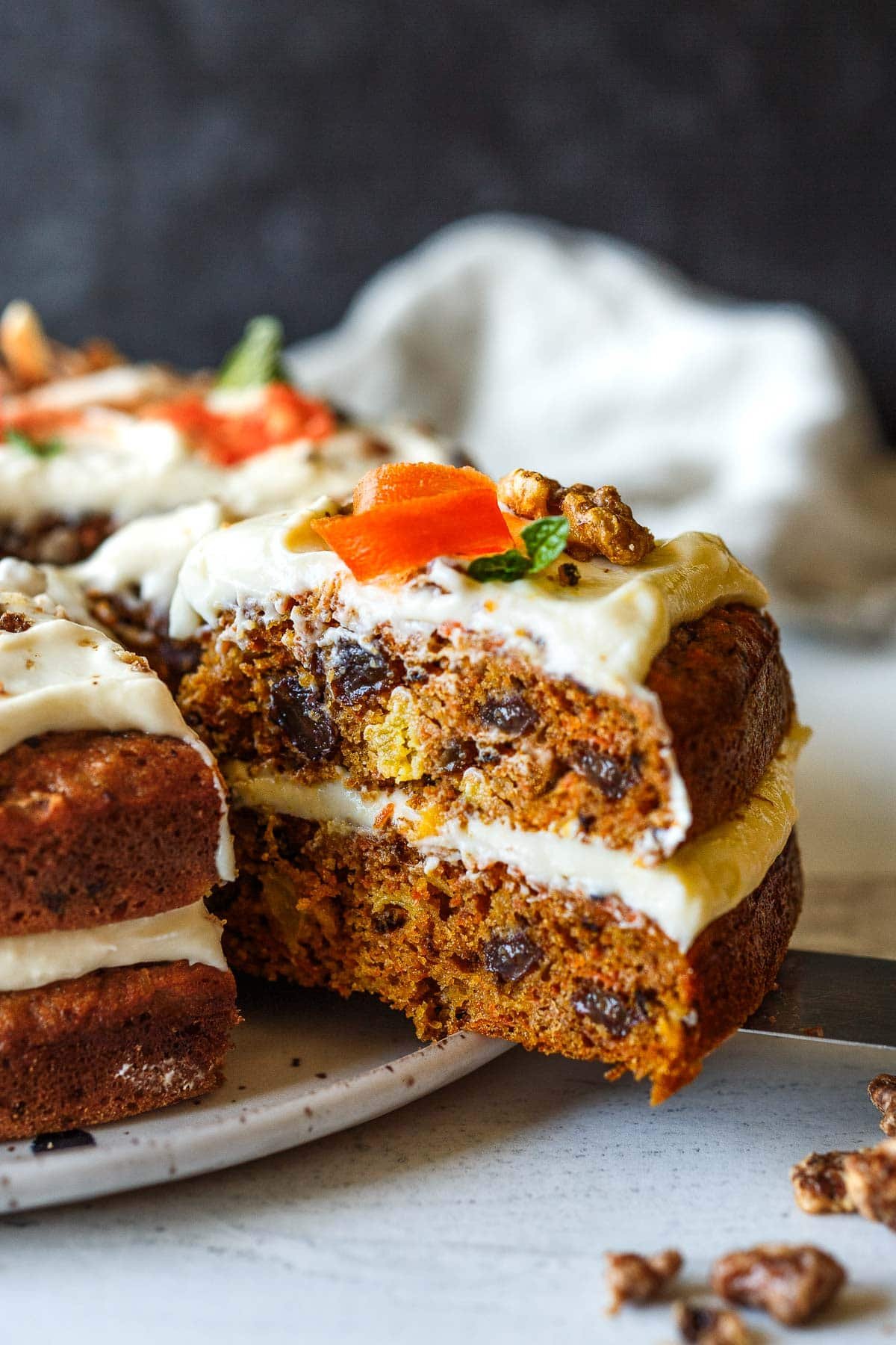 Moist and chock full of carrots, this delightful Carrot Cake recipe with cream cheese frosting offers a lightened-up version that doesn’t compromise on flavor.