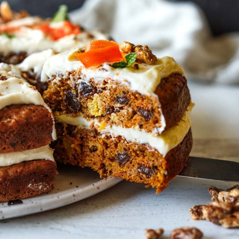 Moist and chock full of carrots, this delightful Carrot Cake recipe with cream cheese frosting offers a lightened-up version that doesn’t compromise on flavor.