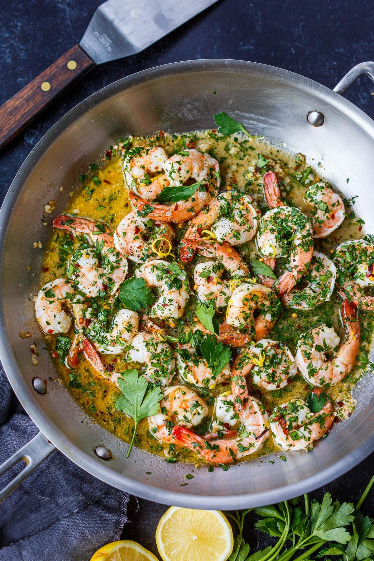 skillet with shrimp scampi in garlic lemon butter sauce.