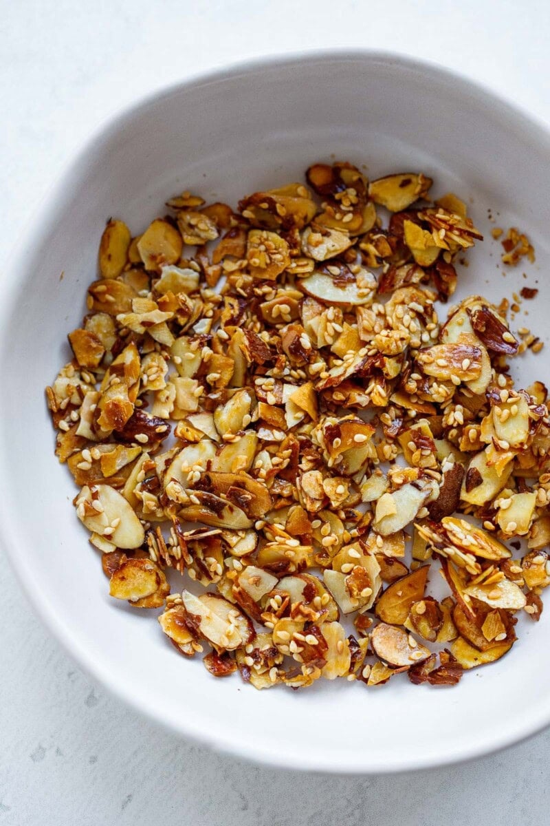 small bowl of sesame almond brittle.