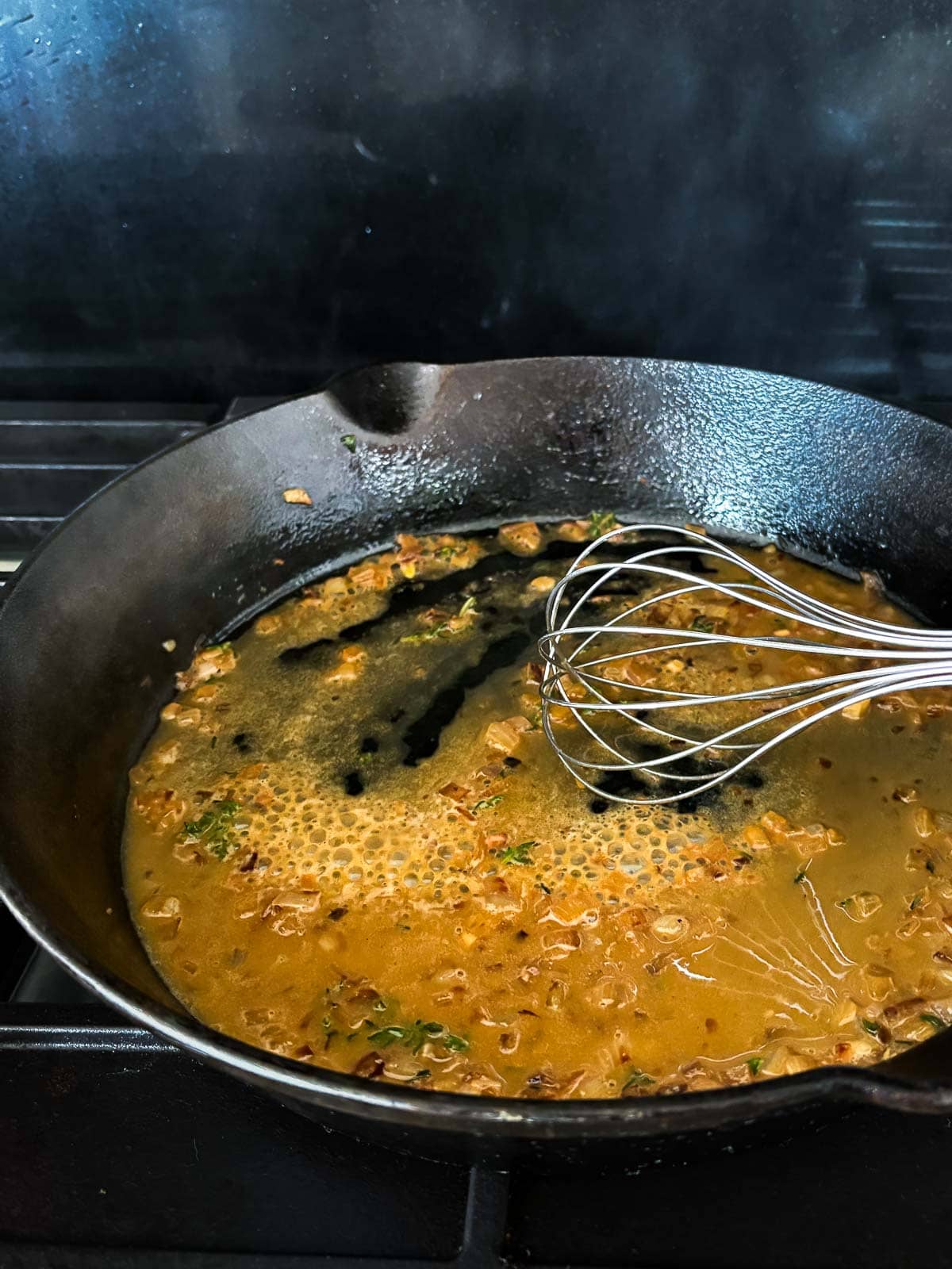 whisk in cast iron skillet with pan sauce.