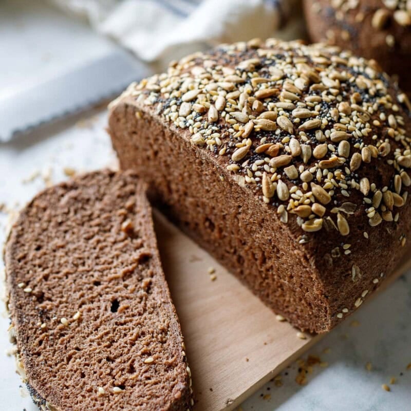 This gluten-free bread recipe is easy to make and tastes like rye bread! Made with teff flour, it's egg-free, dairy-free, nut-free, and made without rice, starches, or gums. Vegan.