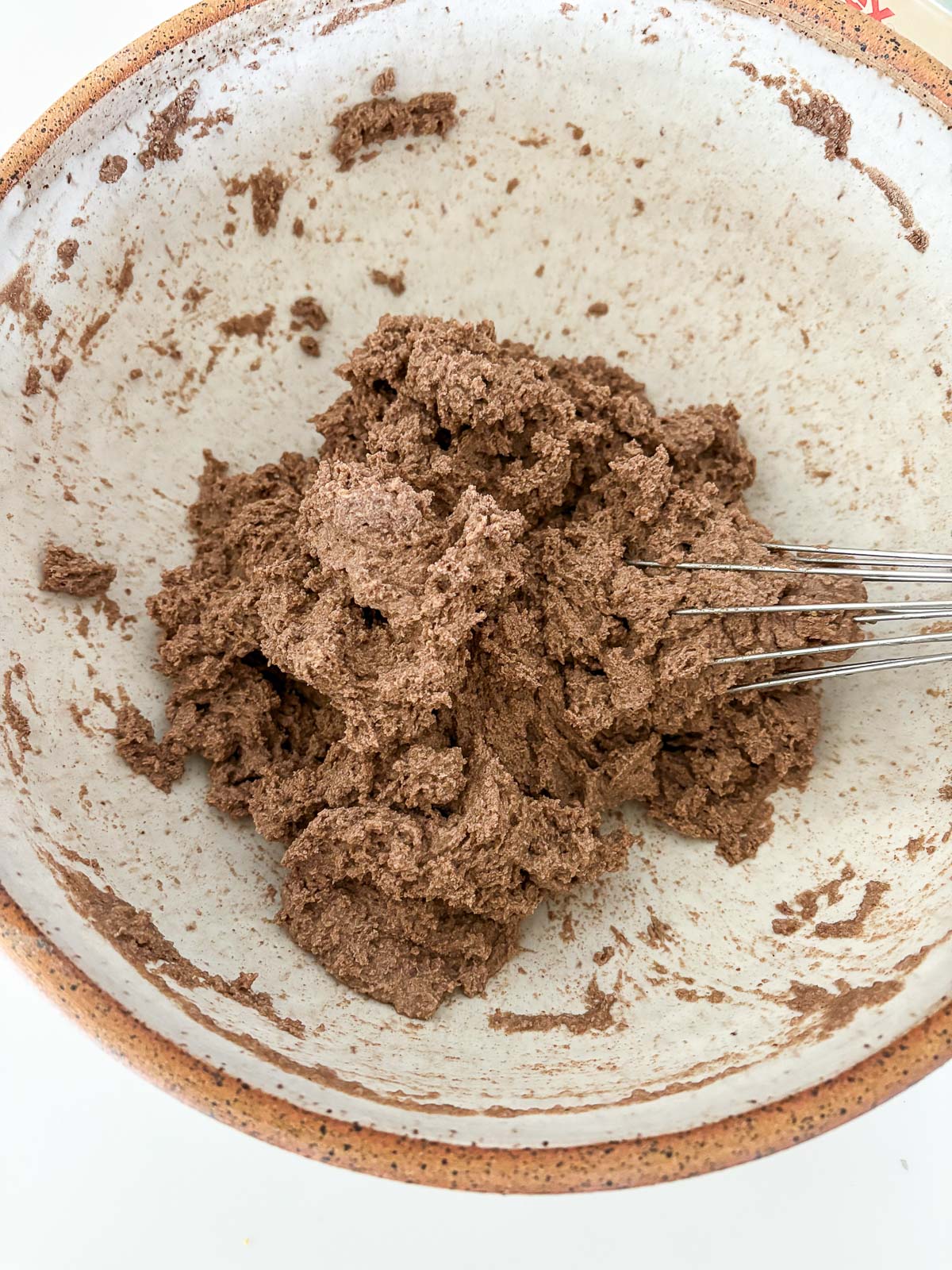 gluten free bread dough mixed together with whisk in bowl.