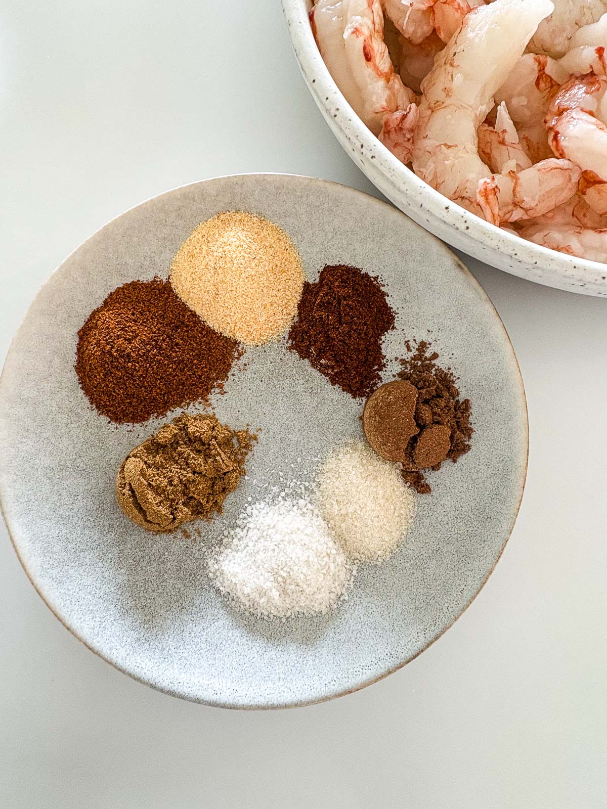 small dish with each of the spices, plus sugar, to season the bowl of shrimp.