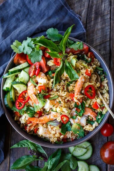Thai Fried Rice, also known as "Khao Pad," is a flavorful and aromatic dish made with jasmine rice, tender shrimp, veggies, and a savory stir-fry sauce.