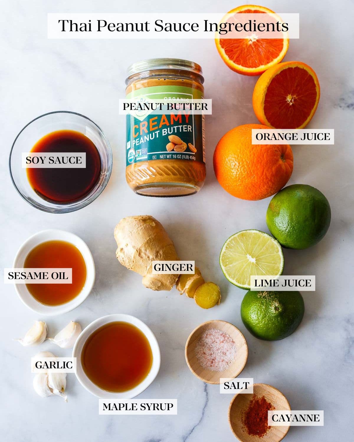 Thai peanut sauce ingredients on a white counter. 