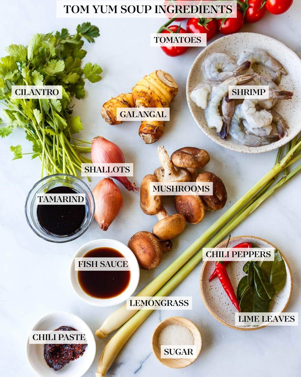Tom Yum Soup ingredients  placed on a white counter. 