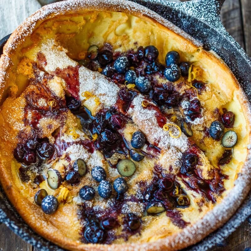Delicious and impressive Blueberry Dutch Baby is made with everyday pantry ingredients and requires only about 10 minutes of hands-on time! Top with maple-sweetened blueberry sauce for a perfect brunch or dessert.